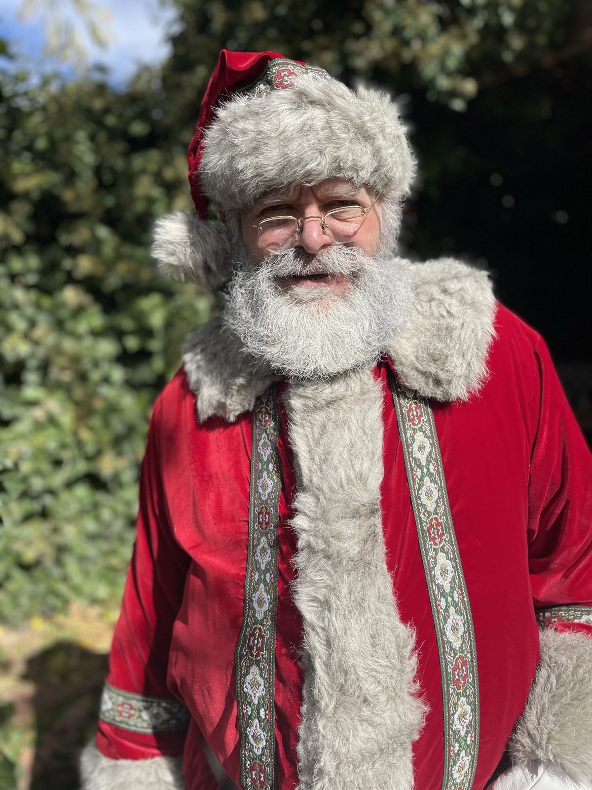 Close-up portrait of Santa Michael in his traditional embroidered suit
